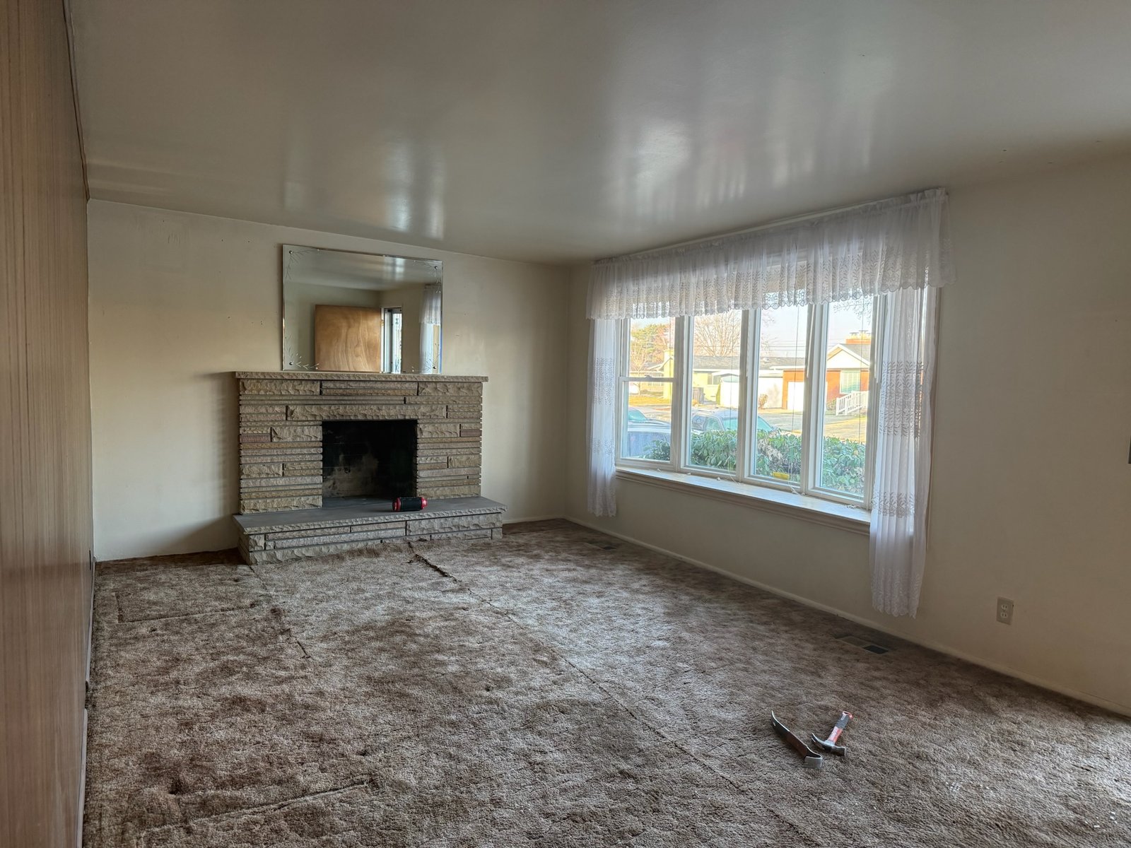 Home Remodeling Utah County — Same Home Before Transformation Before photo of an existing living room before a Utah County home remodeling project